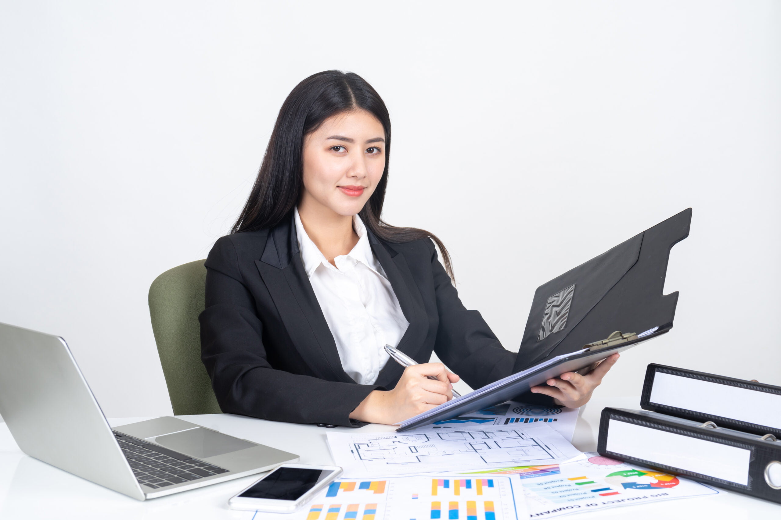 lifestyle beautiful Asian business young woman using laptop computer and smart phone on office desk , business concept.