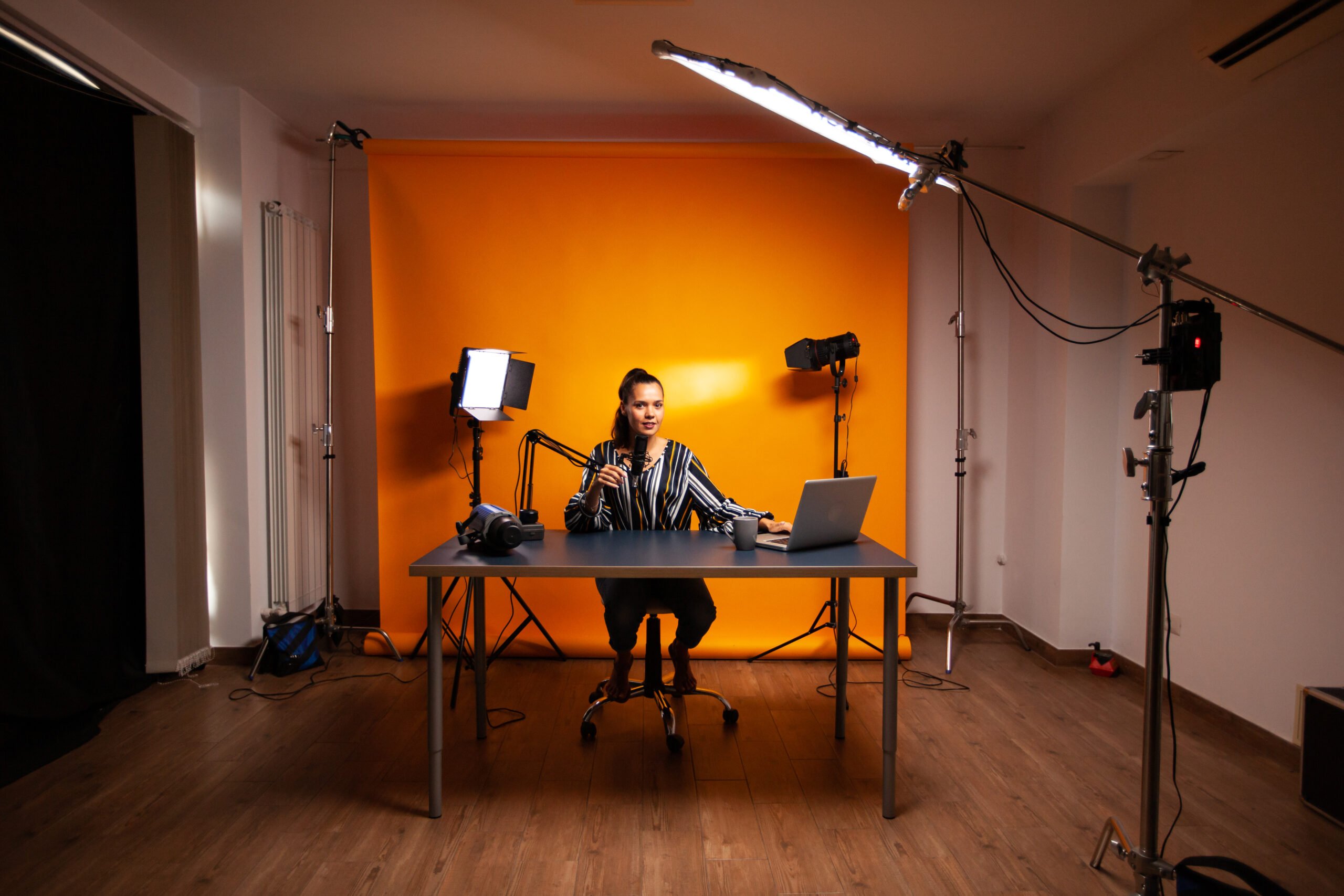 Filming new vlog Famous creative woman recording podcast in home studio